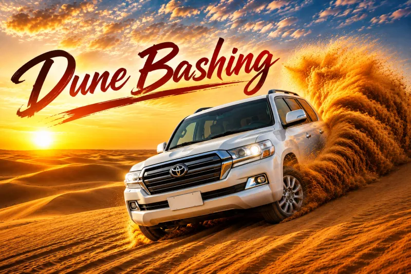 4x4 dune bashing across the red dunes at golden hour